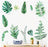 Green leaf wall decals arranged artistically above a desk with a typewriter.