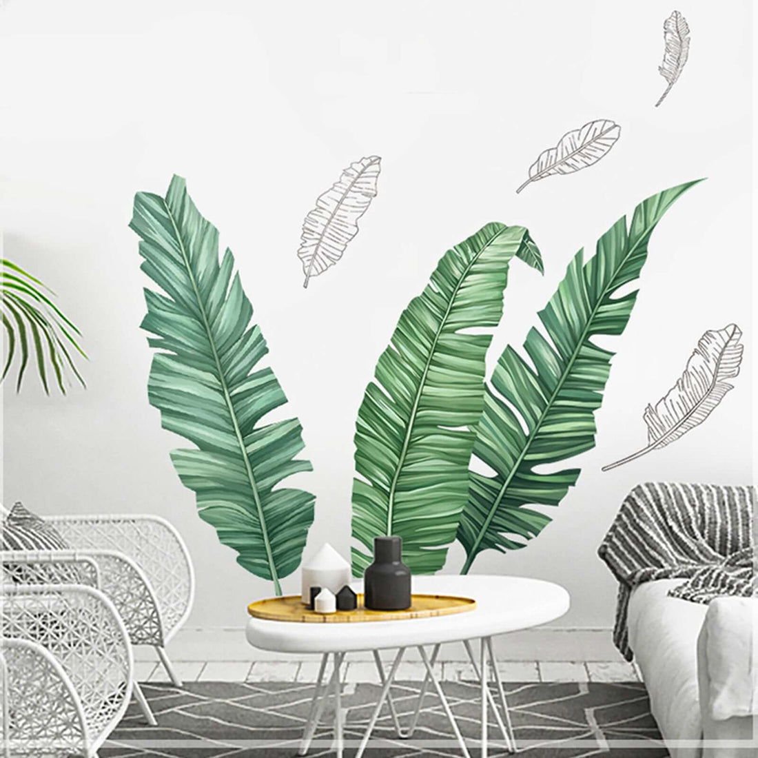 Tropical leaf wall decals in a stylish living room setting.
