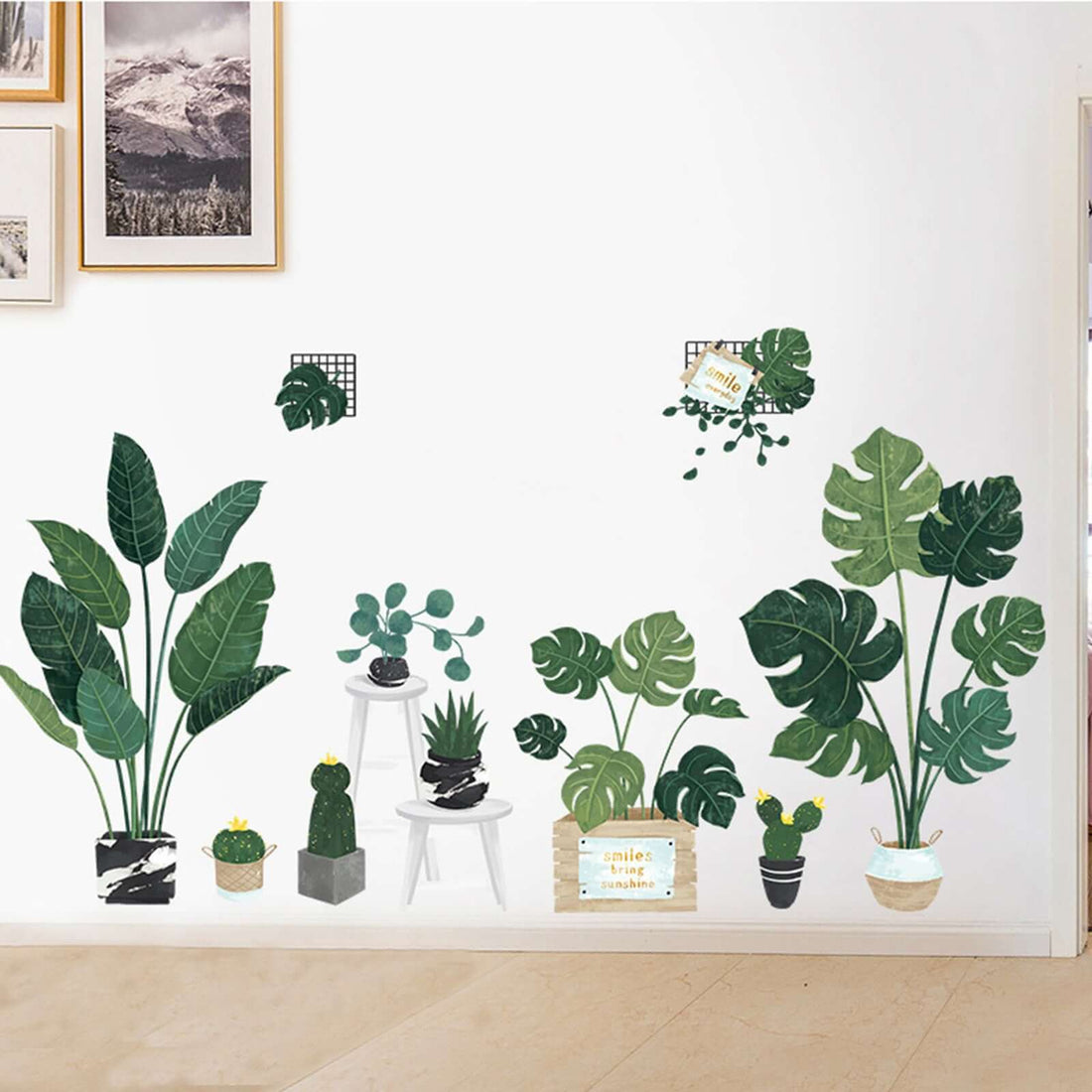 Decorative wall stickers featuring various green plants in pots and shelves.