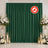 Green wedding backdrop with white floral arrangements and candle decor, flame retardant