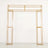 Gold metal display arch frame on a plain background