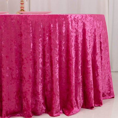 Hot pink velvet tablecloth on a round table for elegant event decor