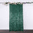 Green sequin backdrop draped with floral accents for events and photography.