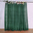 Green glitter backdrop curtain with floral accents for events and photography.