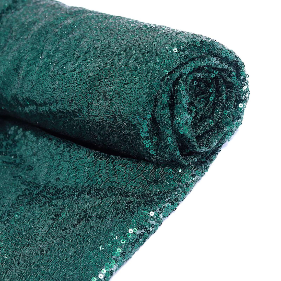 Rolled green sequin fabric on a white background #whtbkgd