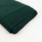 Dark green folded fabric on a plain background