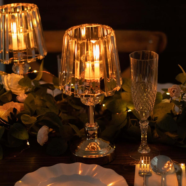 Elegant table lamp with warm glow, surrounded by floral decor and fine dining setup.