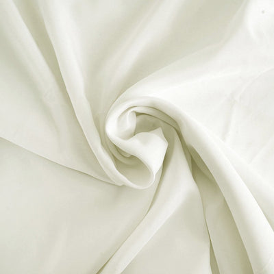 Soft white fabric draped elegantly in a swirl pattern.