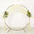 Gold wedding arch with draped fabric and floral arrangements