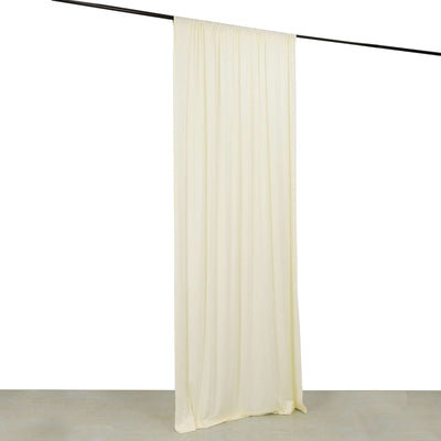 Cream curtain hanging from a black rod against a white background