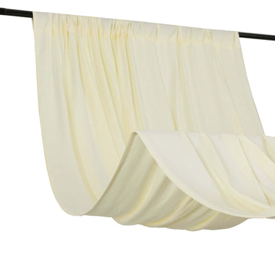 Cream curtain draped on a rod, showcasing soft pleats and texture.
