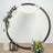 Decorative circular backdrop with draped fabric, flowers, and lanterns