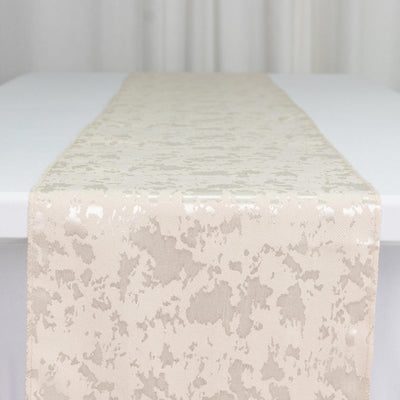 Ivory jacquard table runner on white table, elegant textured fabric close-up