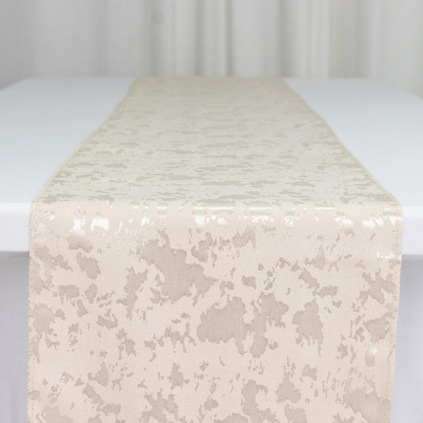 Ivory jacquard table runner on white table, elegant textured fabric close-up
