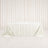 Ivory jacquard tablecloth draped on rectangular table with elegant backdrop