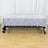 Elegant lace tablecloth draping over a black table.
