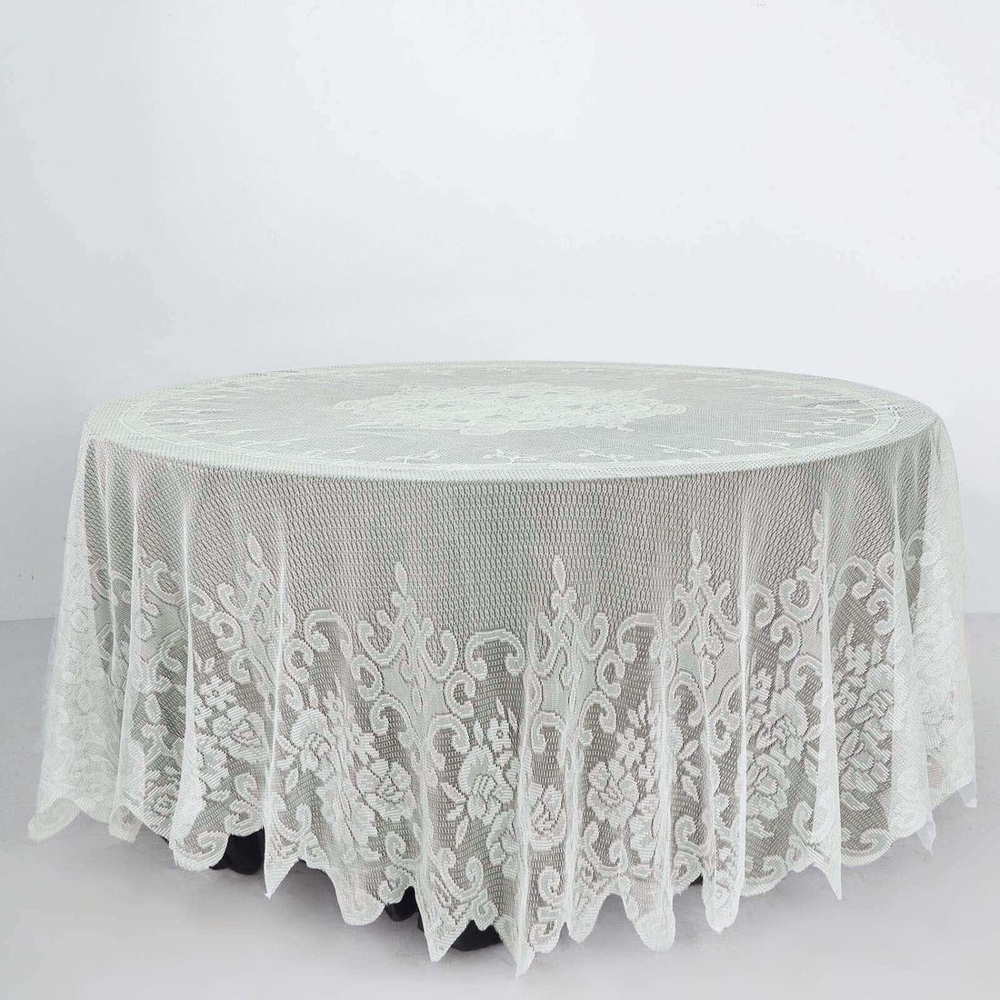 Round lace tablecloth with intricate floral design on a white background.