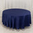 Round navy tablecloth with elegant draping on a plain backdrop.