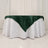 Green satin tablecloth draped elegantly over a white table.