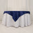 Navy blue tablecloth draped over a round white table