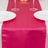 Pink satin table runner on a dining table with plates and glasses.