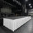 Large concert stage setup with lighting trusses and hanging speakers in a venue