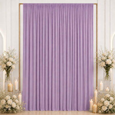 Lavender curtain backdrop with white roses and candles for elegant event decor