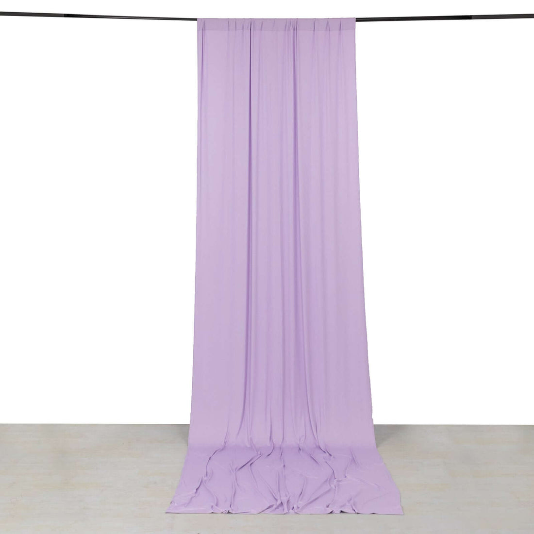 Purple fabric backdrop hanging elegantly in a studio setting.