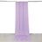 Purple fabric backdrop hanging elegantly in a studio setting.