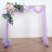 Lavender wedding arch with floral accents and draped fabric