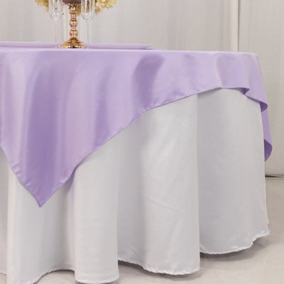 Lavender satin tablecloth draped over a white table