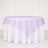 Lavender round tablecloth overlay on white table with elegant drape