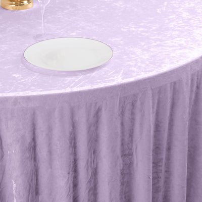 Lavender sheer tablecloth with white plate on a decorated round table