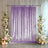 Lavender shimmer wedding backdrop with floral arrangements and candles
