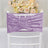 Lavender velvet chair sash on white chair with floral wedding backdrop