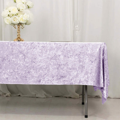 Lavender velvet tablecloth on dining table with white floral centerpiece