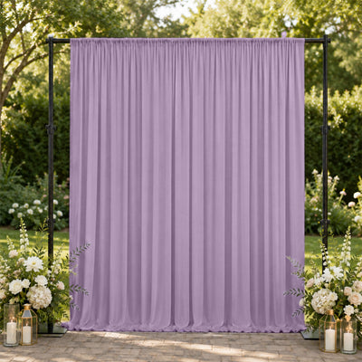 Lavender wedding backdrop with floral arrangements and outdoor garden setting