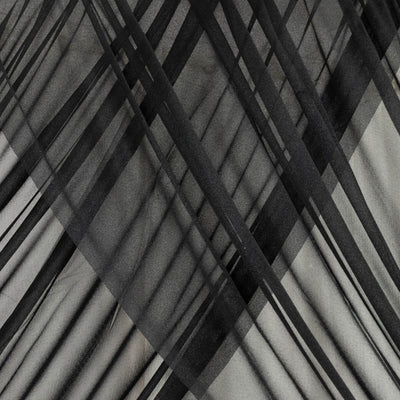Black and gray abstract fabric pattern with layered diagonal lines. #whtbkgd