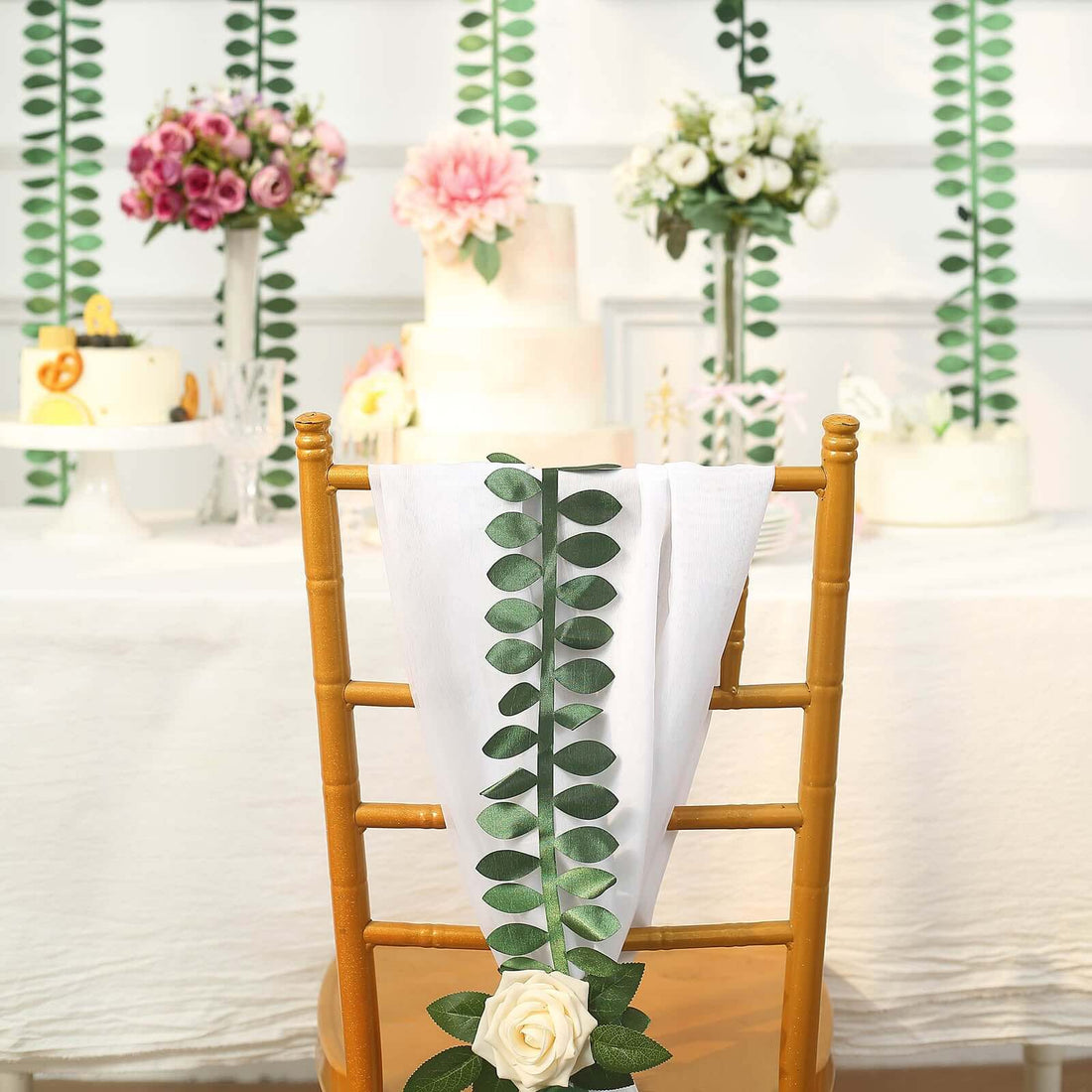 Decorated chair with floral accents at a wedding reception table.