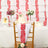 Decorative chair with red accents at a festive table setting.