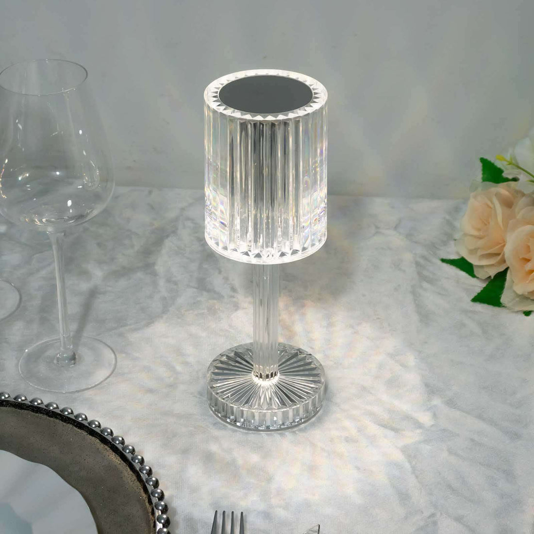 Crystal table lamp with elegant design and reflective details.