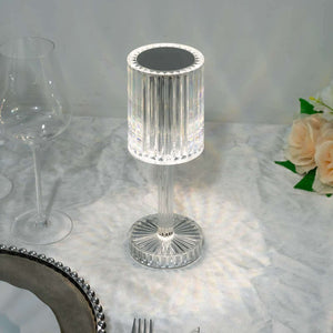 Crystal table lamp with elegant design and reflective details.