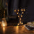 Vintage light-up letter 'Y' on a wooden table, adding a warm glow to the decor.