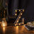 Vintage marquee letter "Z" with warm lights on a wooden table.