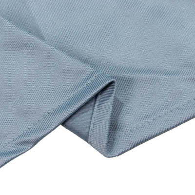 Light blue ribbed fabric close-up with folded hem detailing