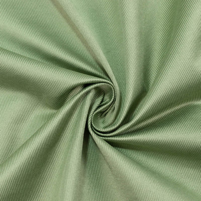 Light green ribbed fabric swatch with a spiral fold texture