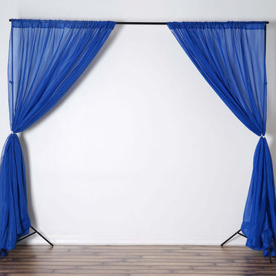 Blue sheer curtains draped on a black frame against a plain white wall.