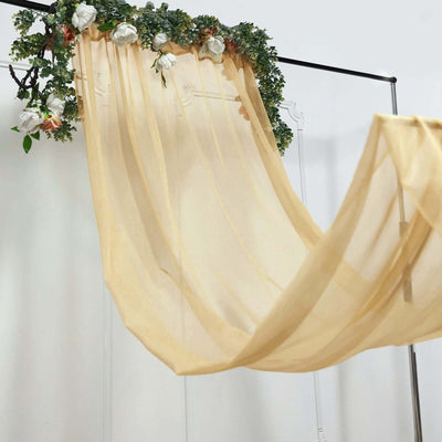 Sheer drapery with floral accents hanging elegantly on a display frame.