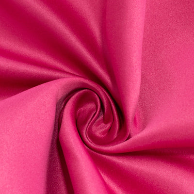 Pink satin fabric close-up showcasing its smooth texture and vibrant color. #whtbkgd