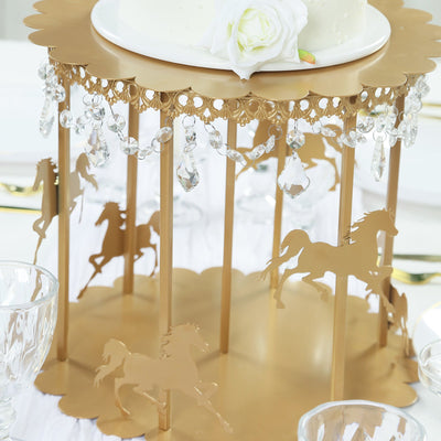Gold carousel cake stand with horse silhouettes and crystal embellishments.